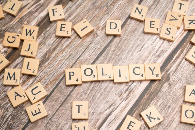 https://www.pexels.com/photo/the-word-policy-spelled-out-in-scrabble-letters-19783681/